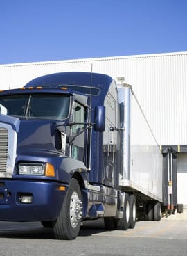 navy semi truck loading cargo - cargo coverage